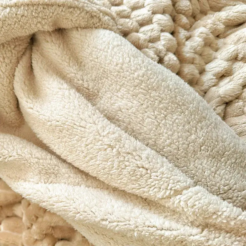Cream-colored double layer lamb plush throw blanket with soft textured fleece and chunky knit border for bedroom use