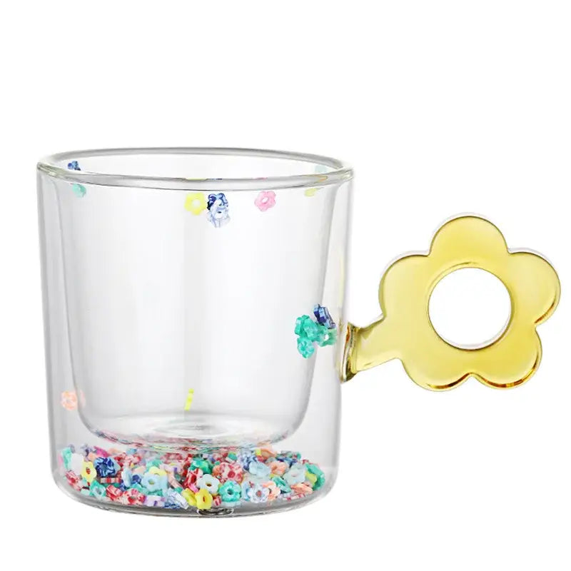 Clear double wall glass mug with yellow flower handle and colorful glitter flowers for kitchen and dining room use