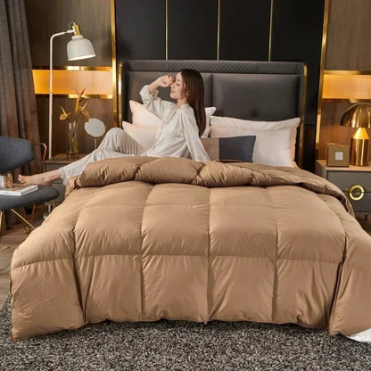 A plush tan down duvet with stitched square panels filled with 95 white goose down for five-star hotel warmth