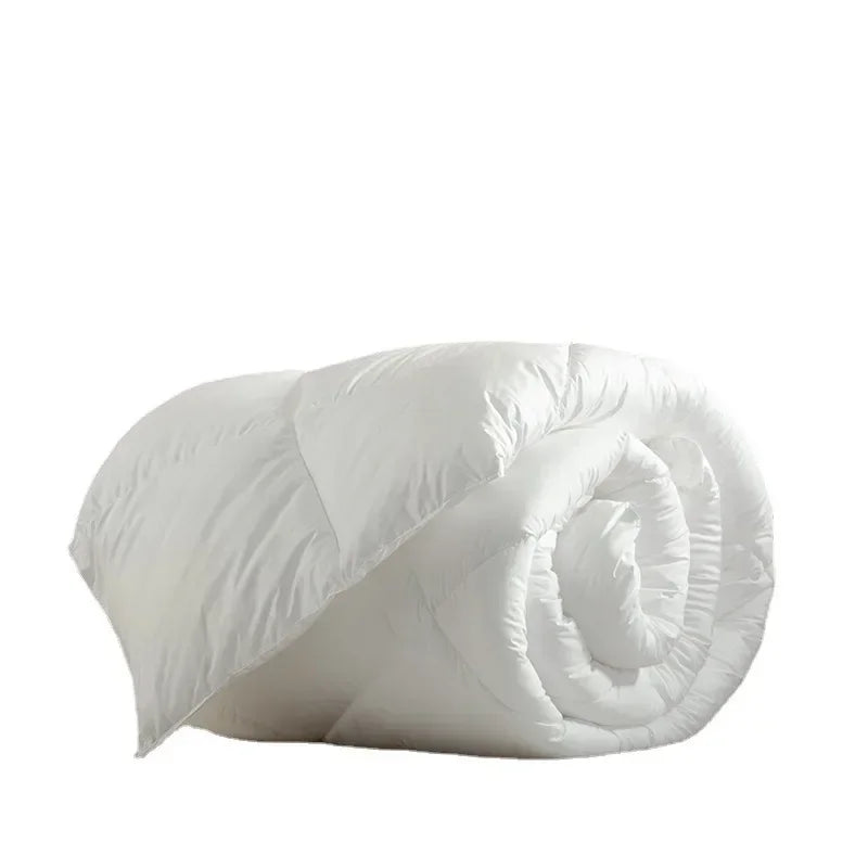A plush white quilted down duvet rolled neatly made with 95 white goose down for warm five-star hotel use