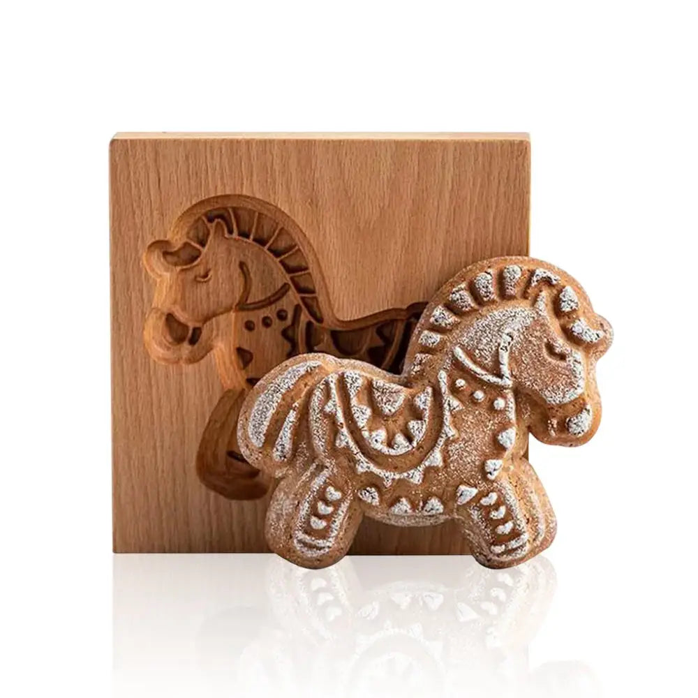 A golden-brown gingerbread cake wooden horse cookie decorated with white icing from decorbites gingerbread cake wooden mold