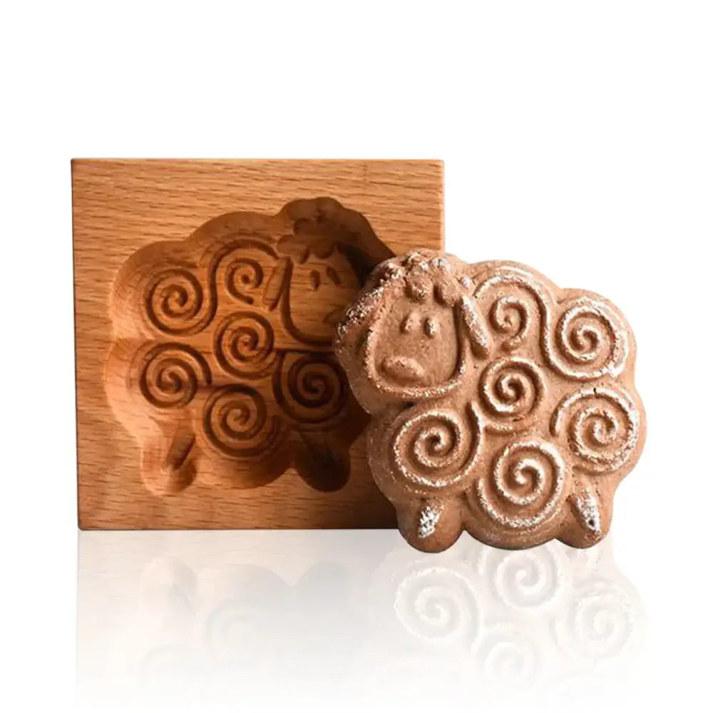 A rustic wooden mold shaped like a sheep with intricate spirals and matching gingerbread cake wooden cookie decorbites gingerbread cake