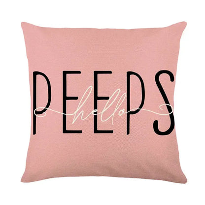 Pink easter bunny rabbit linen cushion cover with peeps hello printed in black and white script for living room
