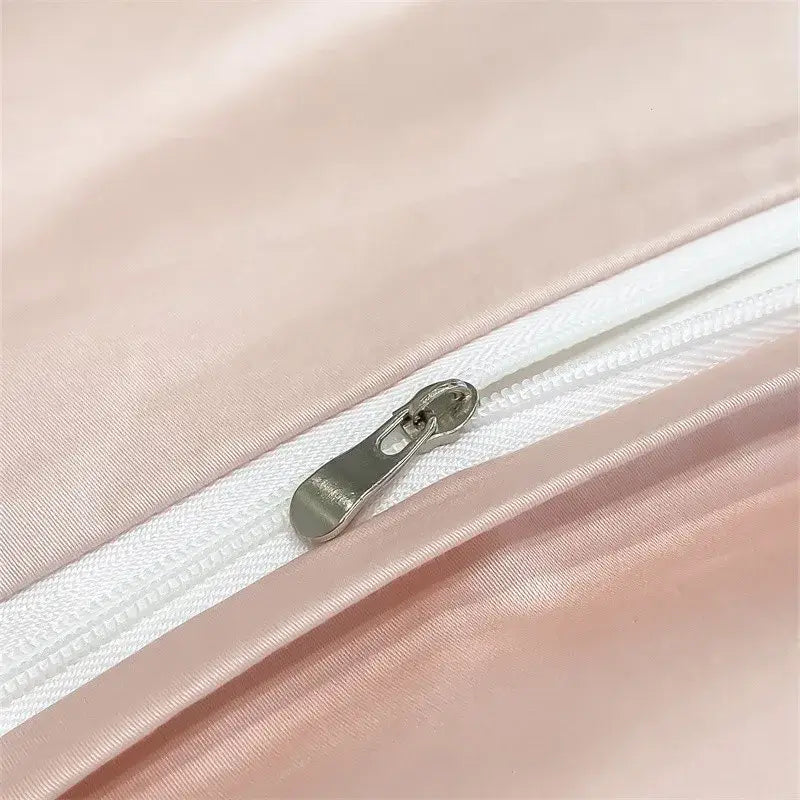 A sleek silver zipper on the decorbites 1000tc egyptian cotton duvet cover with soft pink satin fabric