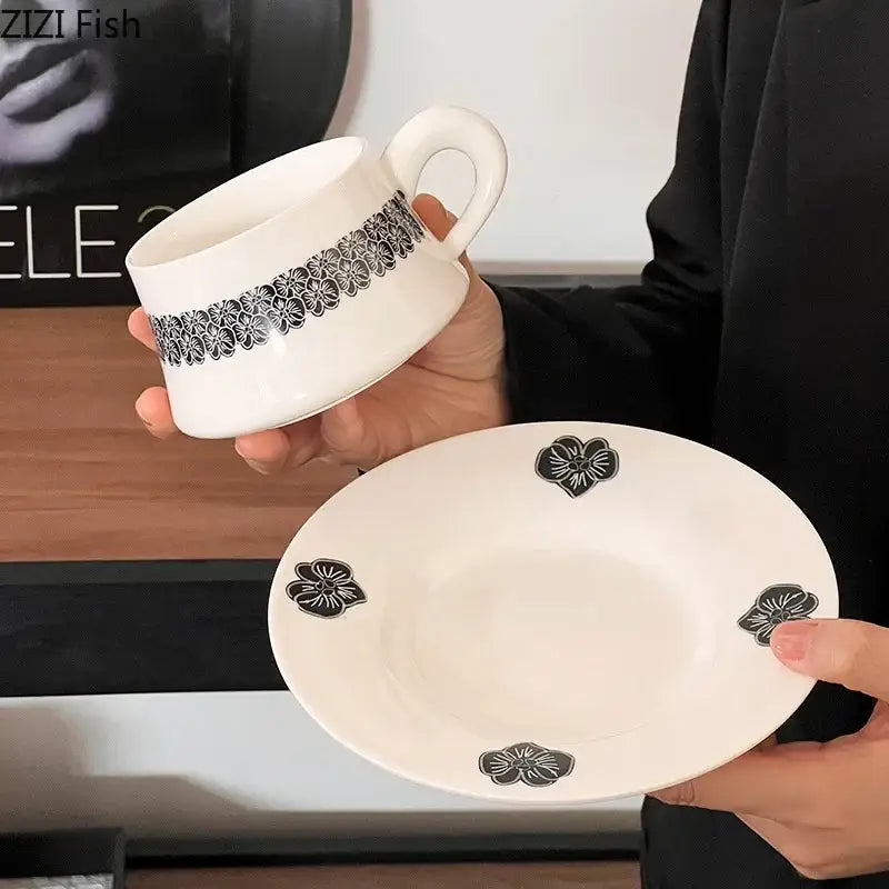 Elegant black and white floral porcelain cup and saucer set with matching mug set for dining room use