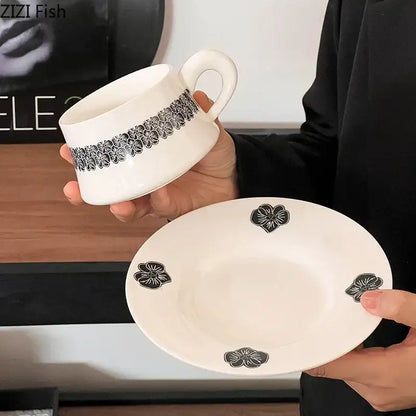Elegant black and white floral porcelain cup and saucer set with matching mug set for dining room use