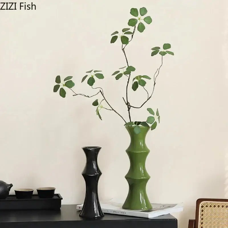 A sleek glossy green bamboo shape ceramic vase with segmented design for elegant living room decorbites bamboo shape decor