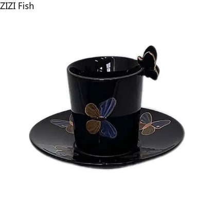 Elegant black ceramic tea cup and saucer set with blue gold and silver butterfly decals and matching butterfly handle