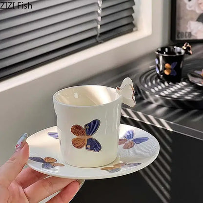 Elegant black butterfly ceramic tea cup and saucer set featuring white ceramic tea cup with butterfly handle and painted butterflies