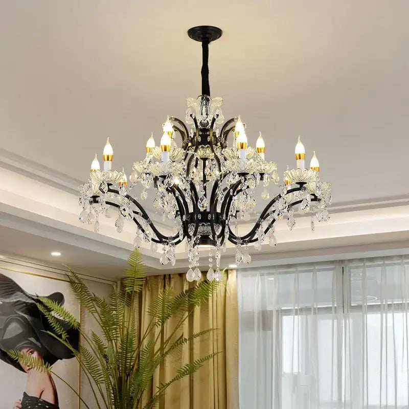 Elegant black wrought iron crystal candle chandelier lighting with sparkling droplets and candle-style bulbs for dining room decorbites