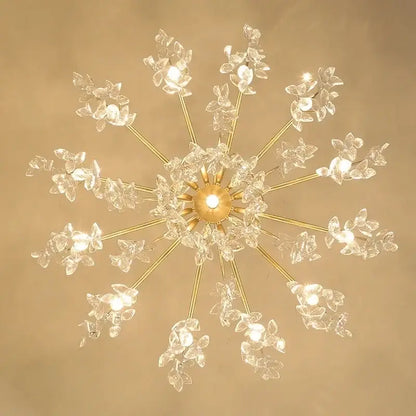 Gold-toned elegant black crystal chandelier with crystal flower accents and multiple illuminated bulbs for dining room