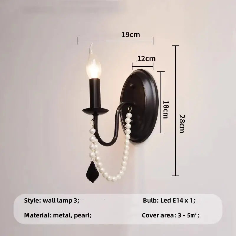 Elegant black crystal chandelier pendant light featuring a black metal frame with candle-style bulb and pearl beads