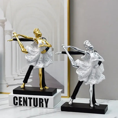 Elegant black and white ballet dance girl double statue featuring golden and silver figurines with lace dresses on black bases