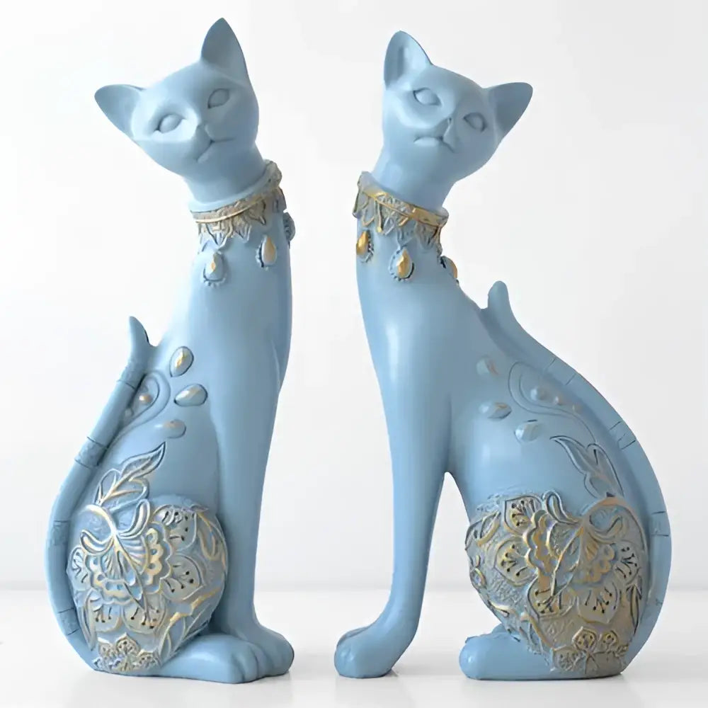 Pair of light blue and gold ornate decorbites cat statues with beaded necklaces for elegant living room decor