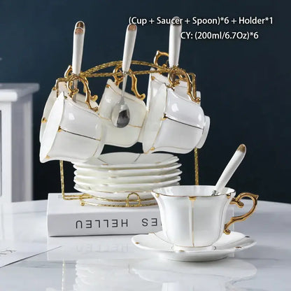 Elegant bone china tea set with gold trim and matching spoons on ornate golden stand for decorbites elegant bone china