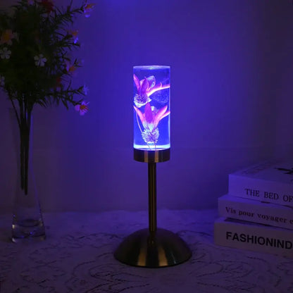 Elegant brass decorbites eternal flower desk lamp with a cylindrical glass shade and purple glowing eternal flower acrylic