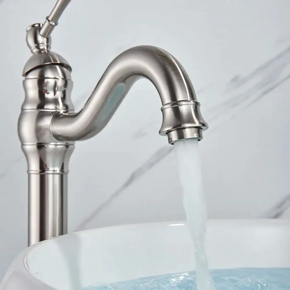 Elegant brushed nickel single handle stainless steel sink faucet with curved spout and decorative ridged accents for bathroom use