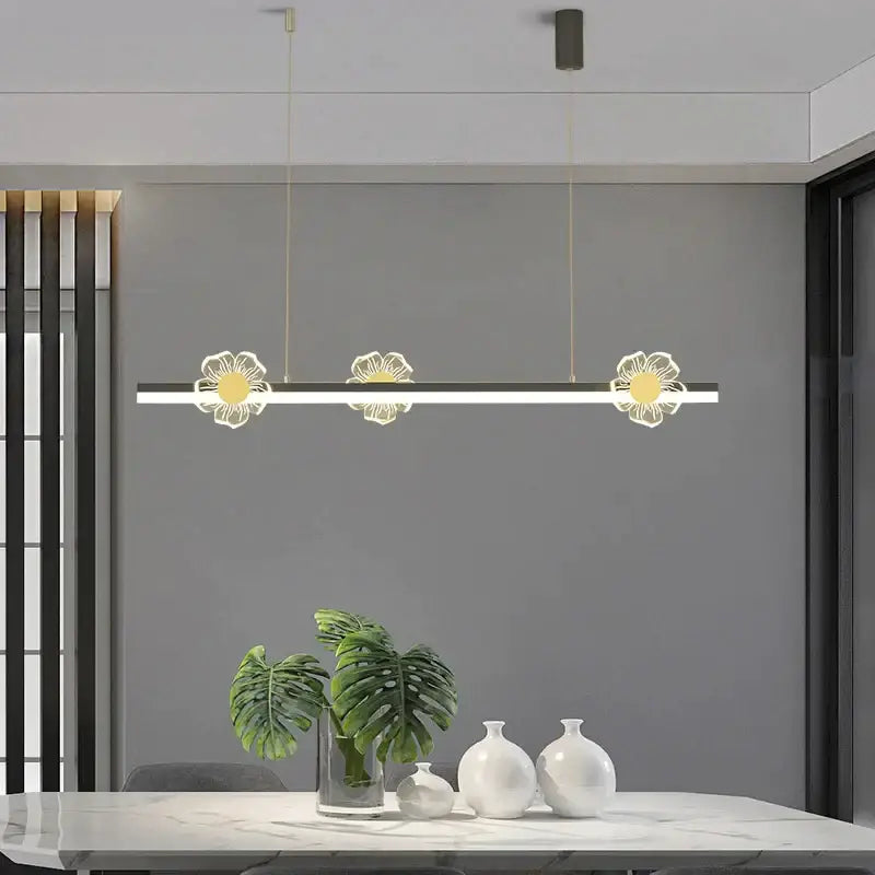 Modern linear pendant light with three illuminated gold and white floral designs decorbites elegant butterfly chandelier