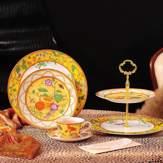 Yellow porcelain dessert stand with gold accents and floral design from elegant butterfly kitchen tableware set