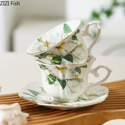 White porcelain camellia porcelain cup and saucer with green floral patterns and gold trim by decorbites camellia