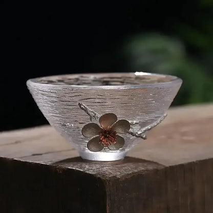 Elegant carved tin glass tea cup set featuring a translucent ripple-textured cup with silver cherry blossom decor