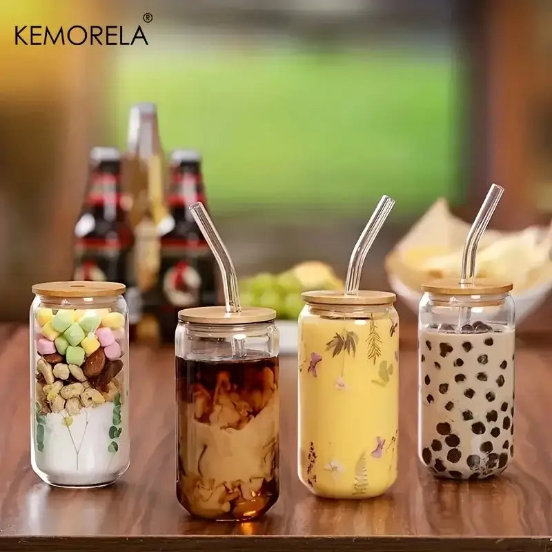 Elegant clear glass bubble tea cup set with bamboo lids and curved glass straws featuring colorful contents