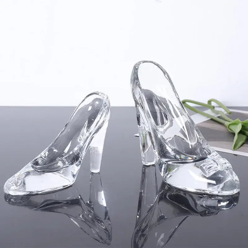 Elegant clear glass high-heeled shoes figurine with transparent glossy finish and intricate toe detailing for decoration