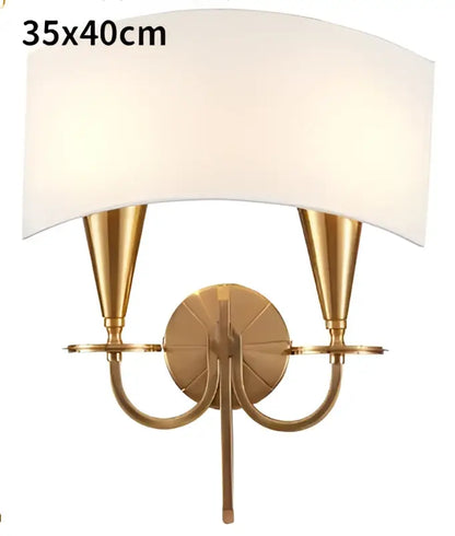 Brass-finished wall sconce with two conical arms and off-white fabric shade for décorbites copper chandelier lights