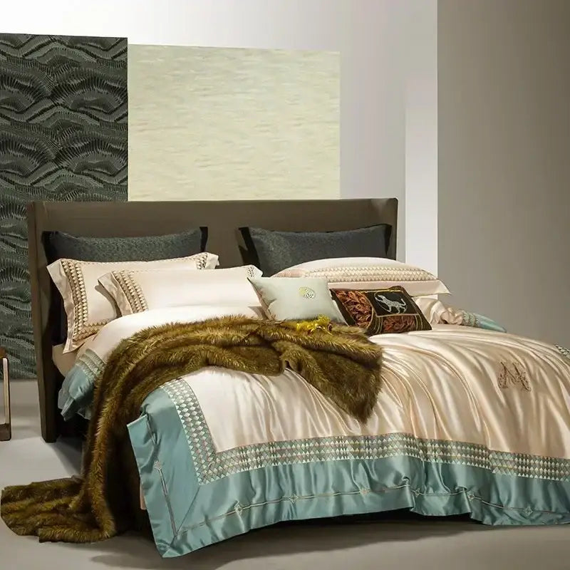 Cream-colored satin duvet cover with teal trim and gold embroidery in decorbites 1200tc egyptian cotton bedding set