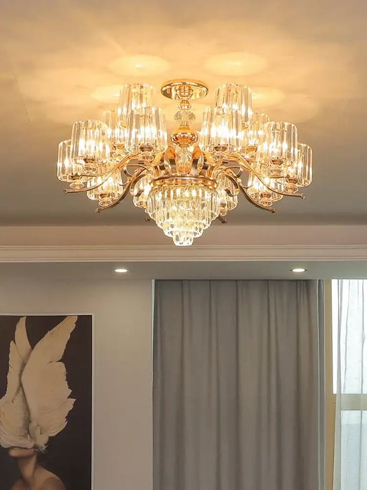Elegant crystal chandelier gold living room lighting by decorbites featuring gold-toned frame with clear crystal prisms and warm glow
