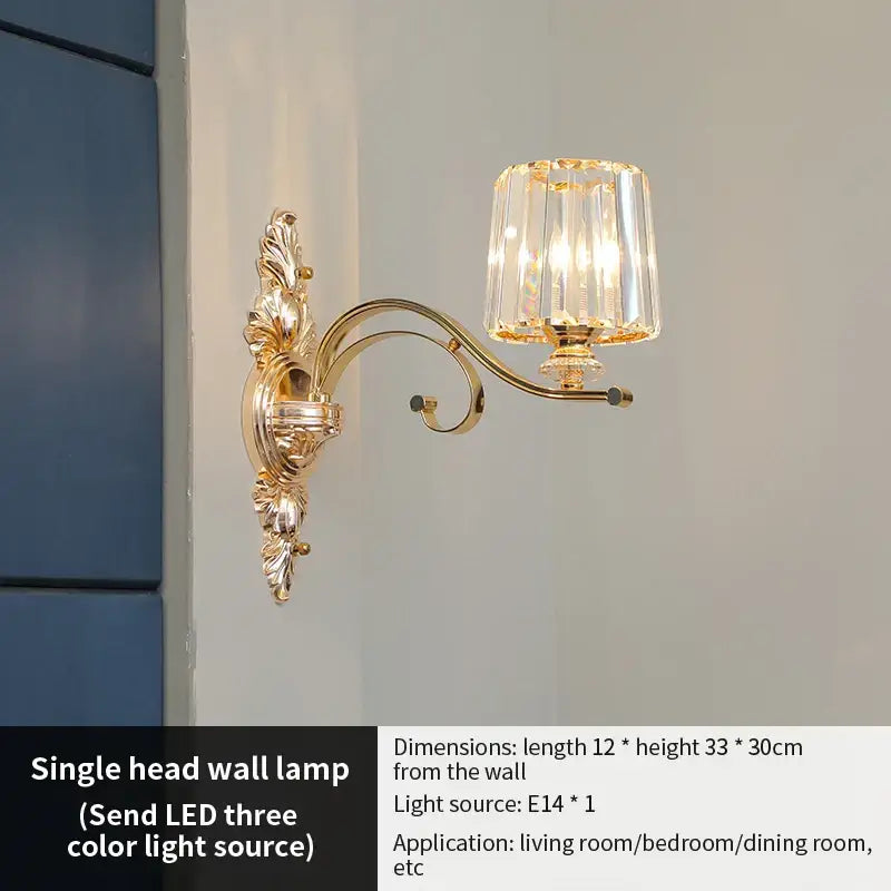 Gold-toned ornate wall sconce with faceted crystal shade for elegant crystal chandelier living room decorbites elegant lighting
