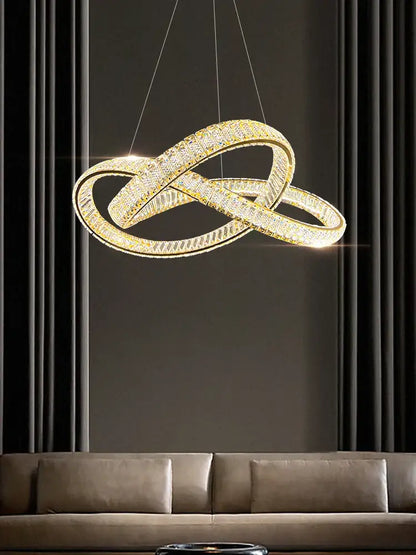 Golden infinity-shaped decorbites elegant crystal chandelier with embedded crystals and sleek modern design for living room