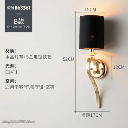 Elegant crystal gold wall lamp with black fabric shade and gold-plated curved metal fixture by decorbites crystal gold