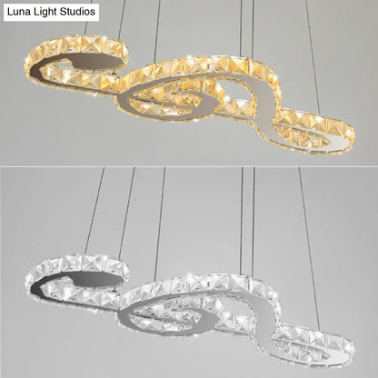 DecorBites™ musical note pendant light featuring a gold-toned clear crystal chandelier with white warm third LED design
