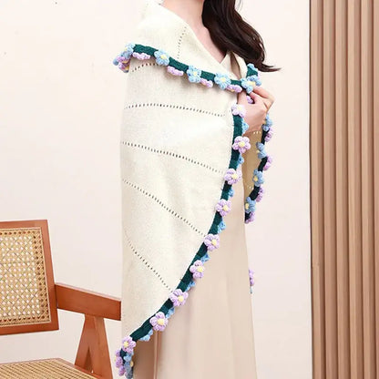 Cream-colored knitted poncho with elegant daisy bouquet soft crocheted flower border for decorbites elegant daisy use