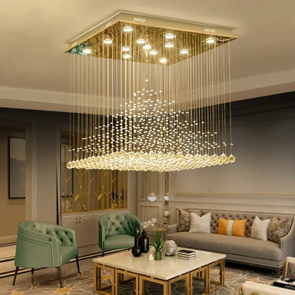 Gold-toned square chandelier with cascading clear and amber crystal strands for elegant duplex villa hotel lobby decorbites elegant duplex