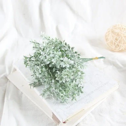 A delicate frost-dusted purple silk flocking lover grass bouquet with soft leafy branches for elegant flocking decorbites