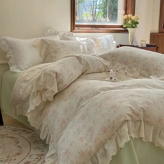 Cream-colored bedding set featuring elegant floral lace ruffles with delicate vintage-inspired edges