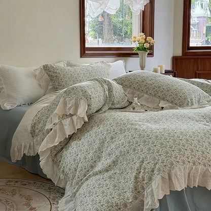 Elegant floral lace bedding set featuring a soft sage green duvet cover with floral lace ruffles and matching pillow sham