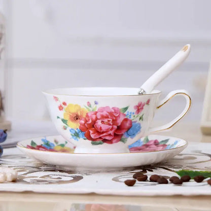 Elegant floral porcelain tea cup set with delicate white cups featuring vibrant floral patterns and gold trim for dining room use