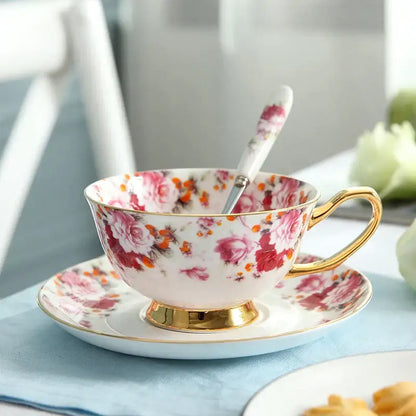 A delicate porcelaine tea set with pink and orange floral pattern and gold trim from decorbites elegant floral tea collection