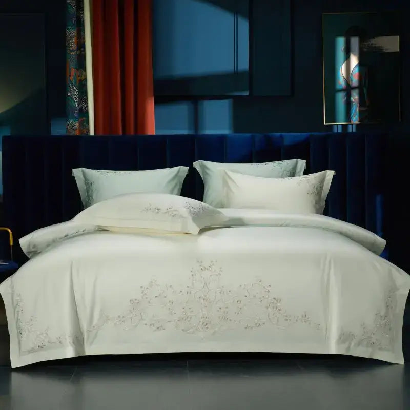 Cream-colored satin duvet cover with elegant flowers embroidery in soft silver thread from decorbites bedding set