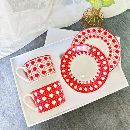 Red and white geometric-patterned bone china tea cup set with matching saucers for elegant dining room use