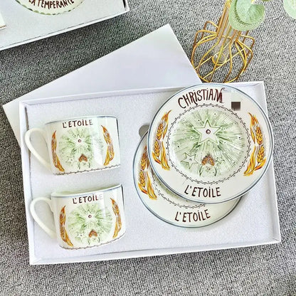 Elegant geometric bone china tea cup set featuring hand-painted green and gold wheat stalks in a gift box