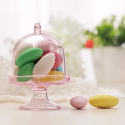 Elegant translucent pink glass candy box tray with domed lid holding colorful decorbites candy box favors