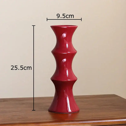 A glossy red bamboo ceramic vase with a segmented hourglass design for elegant decorbites bamboo ceramic decor