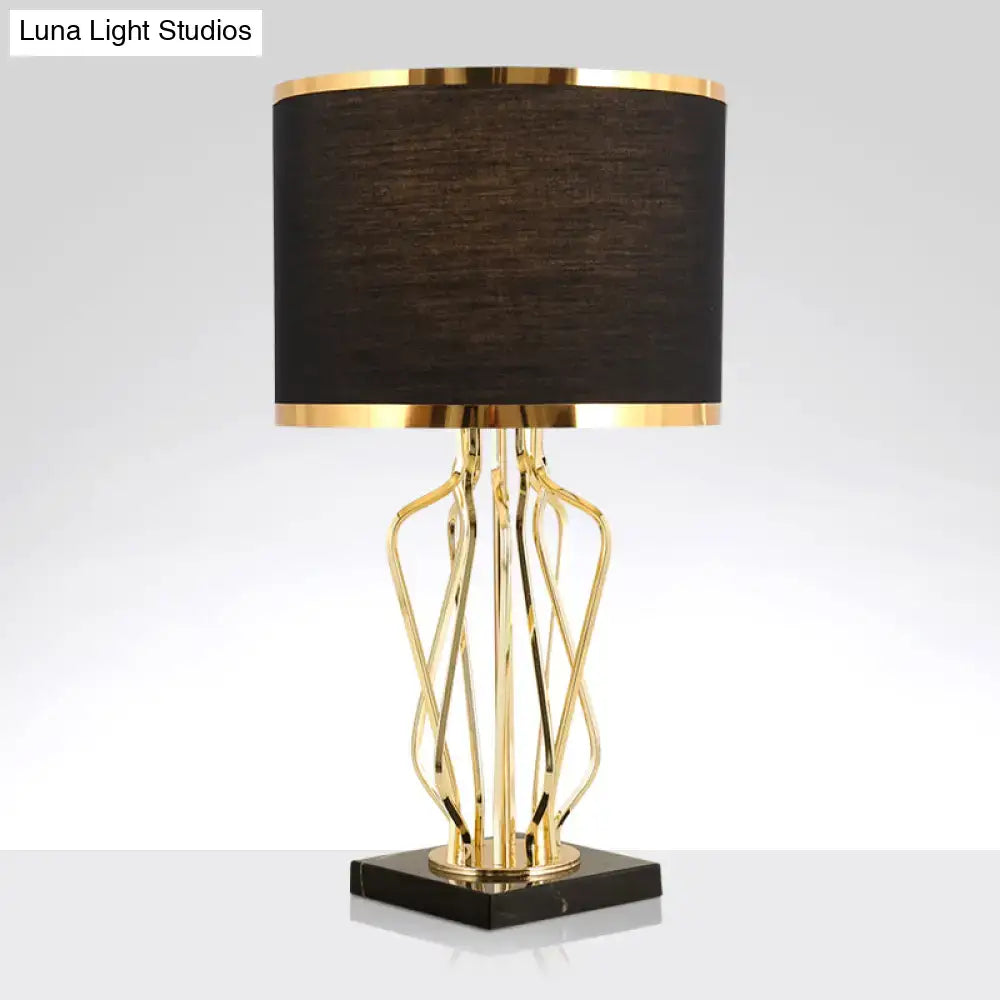 Elegant gold-toned decorbites™ simplicity drum nightstand lamp with black fabric shade and black marble base for led use