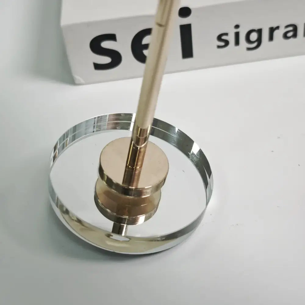 Elegant gold and crystal glass candlestick holder with sleek metallic pen holder and gold-toned accents for decorbites crystal glass decor