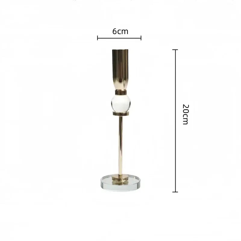 Elegant gold and crystal glass candlestick holder with polished metal stem and clear glass sphere for decorbites decor