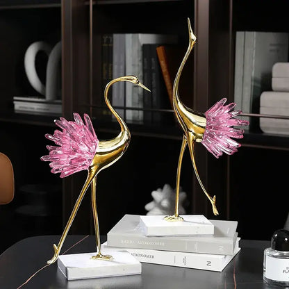 Two elegant gold decorative figurines with pink crystal bird accents on white marble base for living room decorbites crystal bird